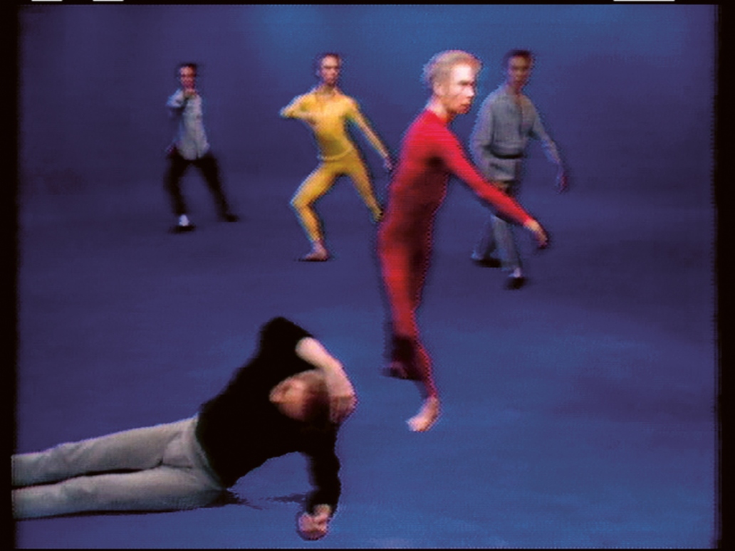 A grainy VHS still of five men in dancer-ly positions.