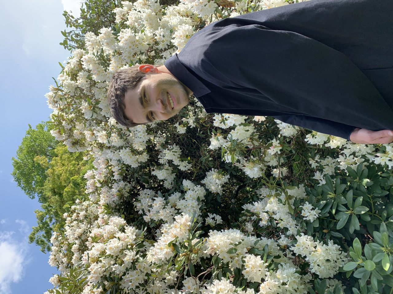The picture is a portrait of myself made by my partner Ellen Lapper. I'm standing in front of a beautiful blossomed tree and I'm facing the camera.